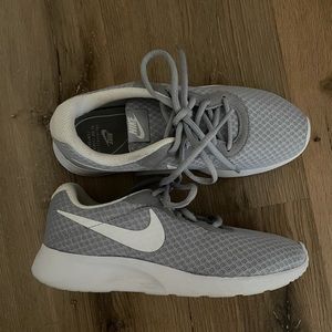 Light Gray Nike Tanjun womens running shoes.
